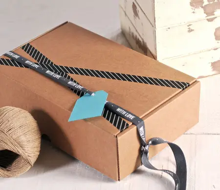 Rectangular box with “With...