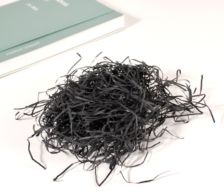 Paper shavings for cardboard boxes